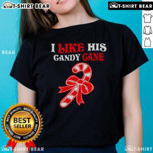 Couple wearing matching Christmas tees featuring 'I Like His Candy Cane' design for festive holiday fun.