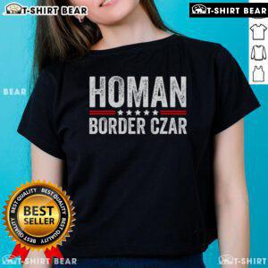 Pretty border Czar Tom Homan with Trump supporters wearing MAGA ladies' tees during a campaign event.