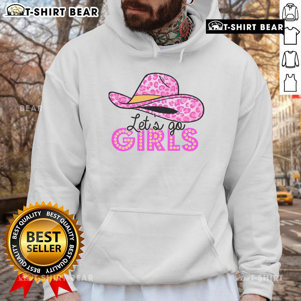 Alt Text: Cowgirl wearing a pretty leopard cowboy hat and western country hoodie, ready for adventure in style.