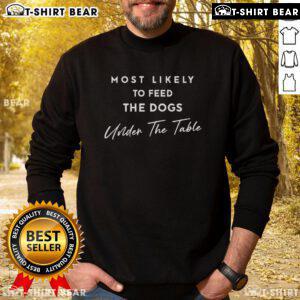 Cozy Thanksgiving sweatshirt featuring 'Most Likely to Feed the Dogs Under the Table' design, perfect for festive gatherings.