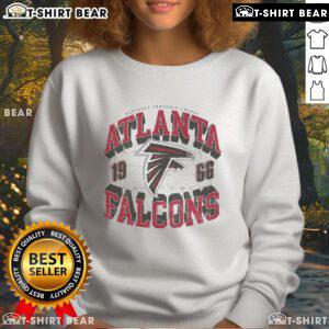 Alt Text: Top Atlanta Falcons Field Arched Wordmark Sweatshirt in red and black, perfect for fans and game day wear.