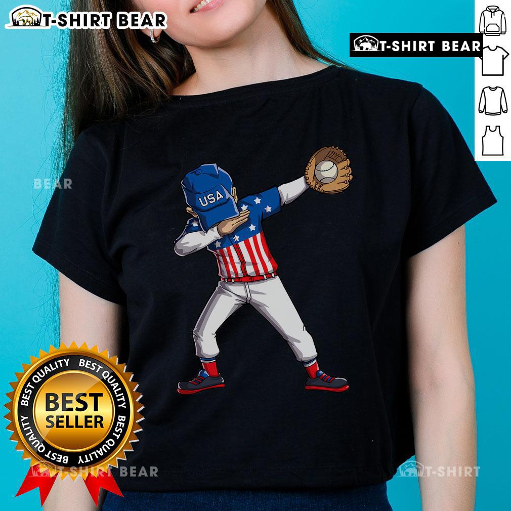 Alt Text: Top dabbing baseball player wearing a USA flag tee for 4th of July celebration, showcasing American pride.