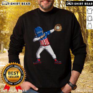 Top dabbing baseball player in USA flag sweatshirt celebrating 4th of July with patriotic style and fun.