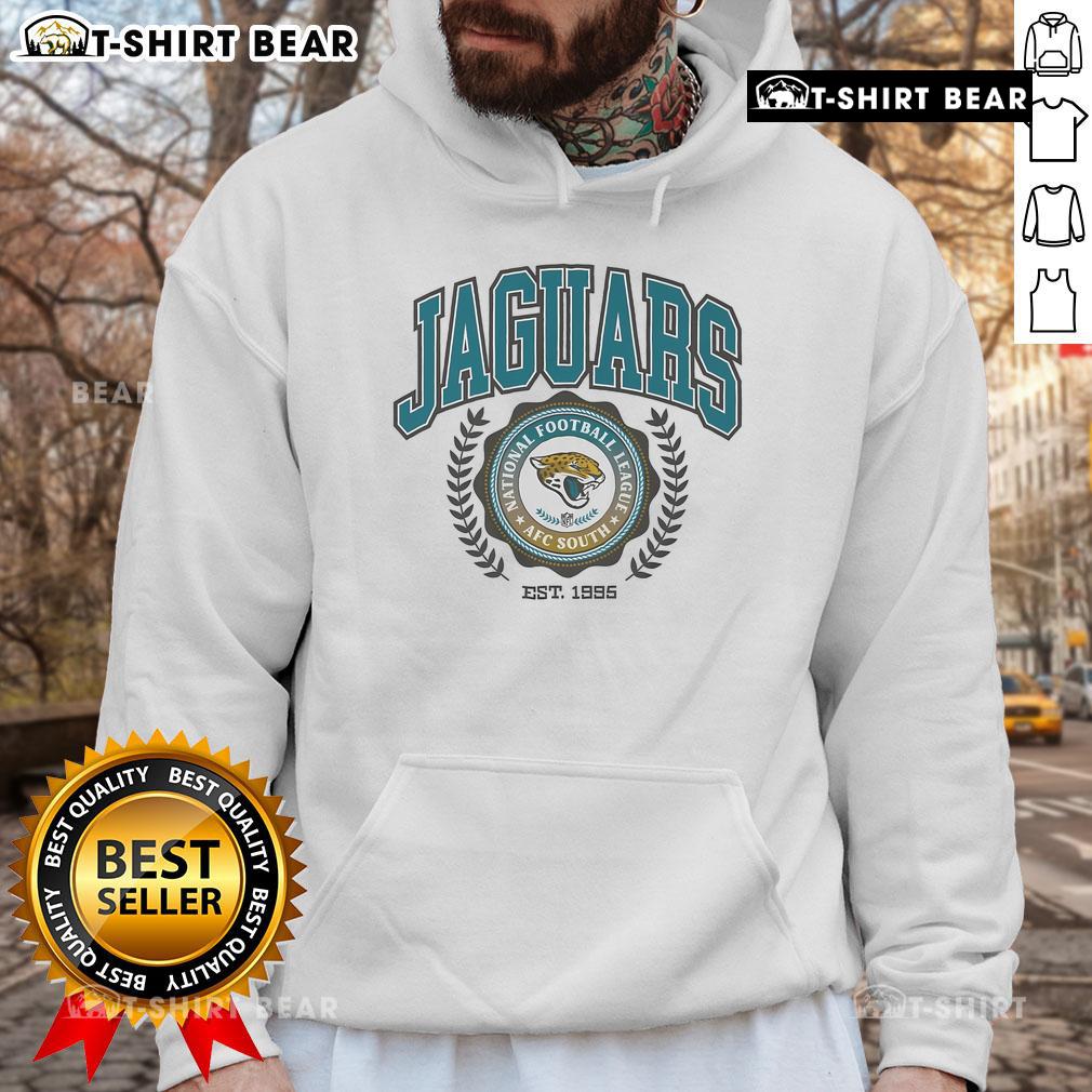 Alt Text: Jacksonville Jaguars team crest hoodie, established 1995, featuring vibrant team colors and logo design.