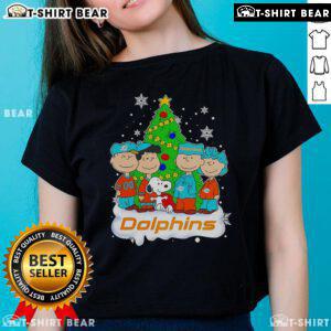 Top Peanuts characters on a Miami Dolphins Christmas tree ladies tee, perfect for festive NFL fans.