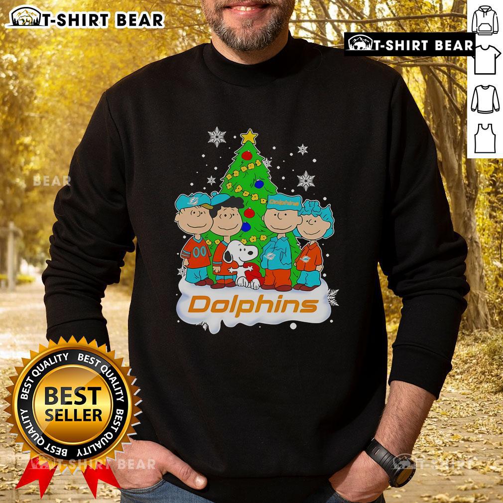 Top Peanuts characters on a Miami Dolphins Christmas tree sweatshirt, perfect for holiday cheer and sports fans.