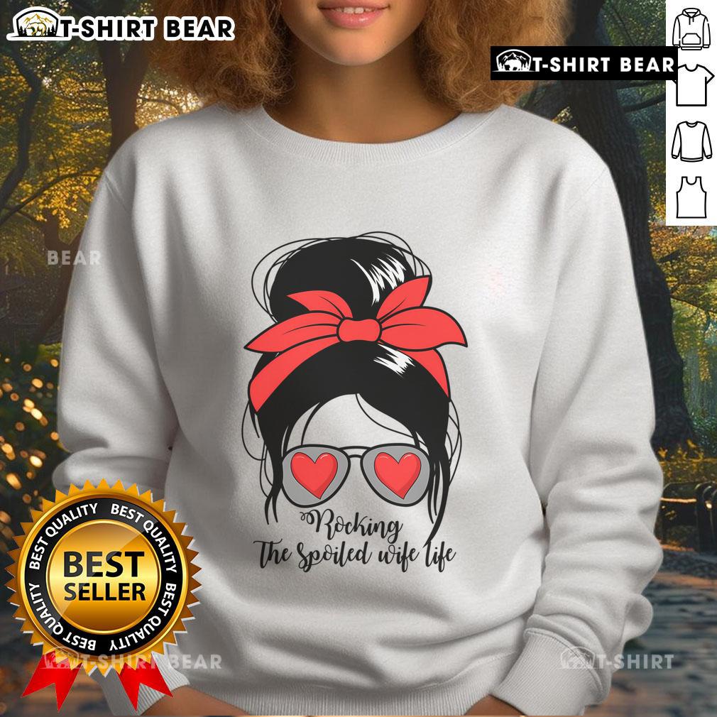 Alt Text: Spoiled wife wearing a messy bun in an Awesome S Rocking Spoiled Wife sweatshirt, showcasing relaxed style.