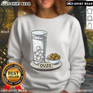 Good vintage Greek ouzo drink and olives served with ladies halftime sweatshirt, perfect for festive gatherings.