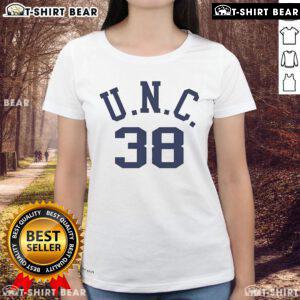Bill Belichick in a casual tee featuring his dad's UNC logo, showcasing his love for family and sports.