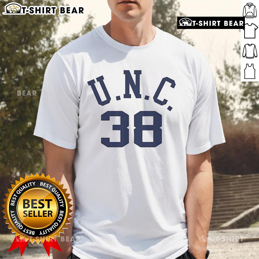 Alt Text: Bill Belichick wearing his dad's UNC t-shirt, showcasing a personal touch at a football event.