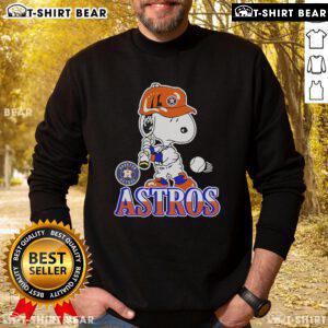 Official Snoopy playing baseball Houston Astros sweatshirt featuring vibrant graphics and cozy design for fans.