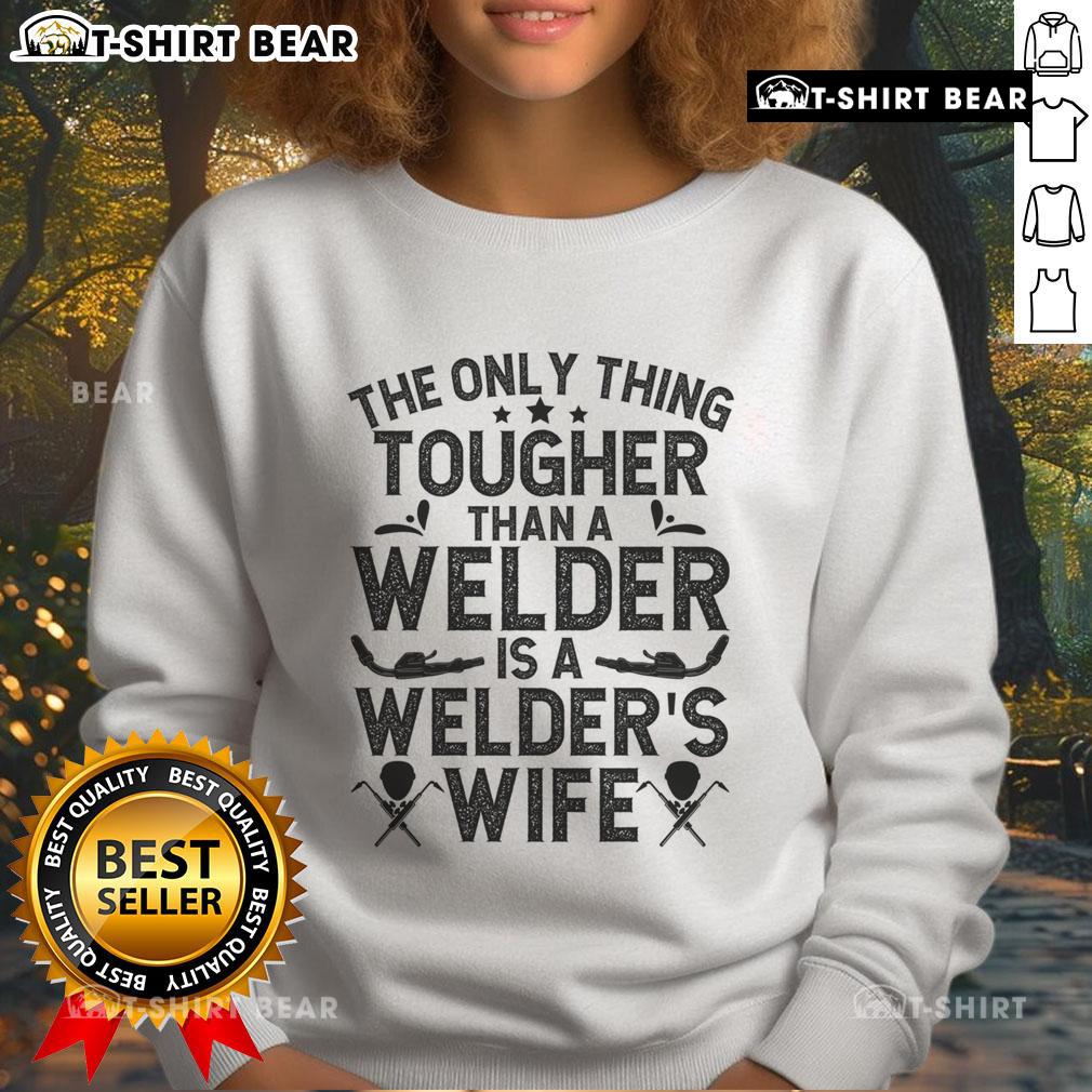 Official 'The Only Thing Tougher Than A Welder Is A Welder Wife' sweatshirt featuring bold text and a cozy design.