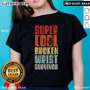 Top Broken Wrist Survivor wearing a tee, showcasing hand injury recovery and arm surgery journey.