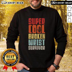 Top broken wrist survivor wearing a sweatshirt, showcasing hand injury recovery after arm surgery.