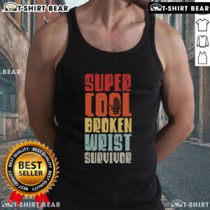 Top Broken Wrist Survivor showing hand injury recovery after arm surgery, wearing a tank top and displaying wrist support.