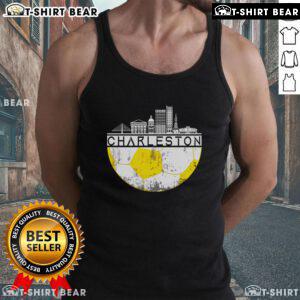 Top Charleston skyline with soccer champs wearing sports tank tops, celebrating victory in a vibrant city backdrop.