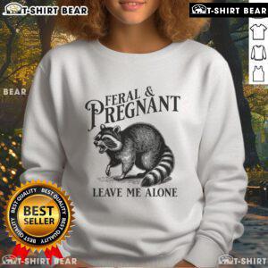 Funny raccoon pregnancy sweatshirt featuring a playful Leave Me Alone design for expectant mothers. Perfect for casual wear!