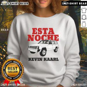 Kevin Kaarl wearing a stylish white Ultra Sodade sweatshirt during the 'Esta Noche Blanca' event, showcasing urban fashion.