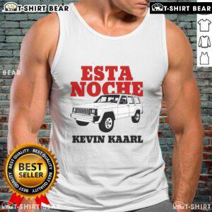 Kevin Kaarl wearing a stylish white Ultra Sodade tank top at the Esta Noche event, showcasing his trendy fashion.