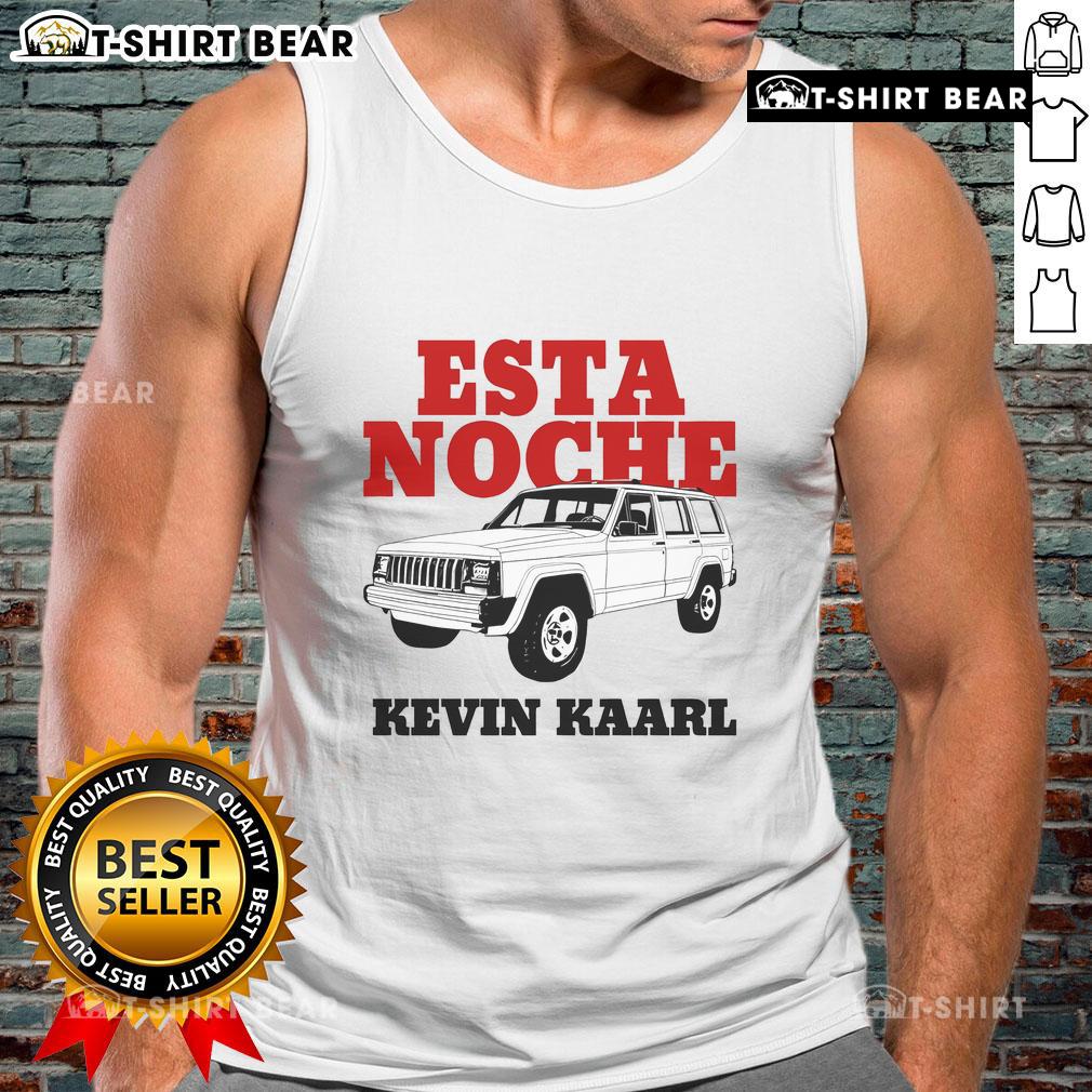 Kevin Kaarl wearing a stylish white Ultra Sodade tank top at the Esta Noche event, showcasing his trendy fashion.