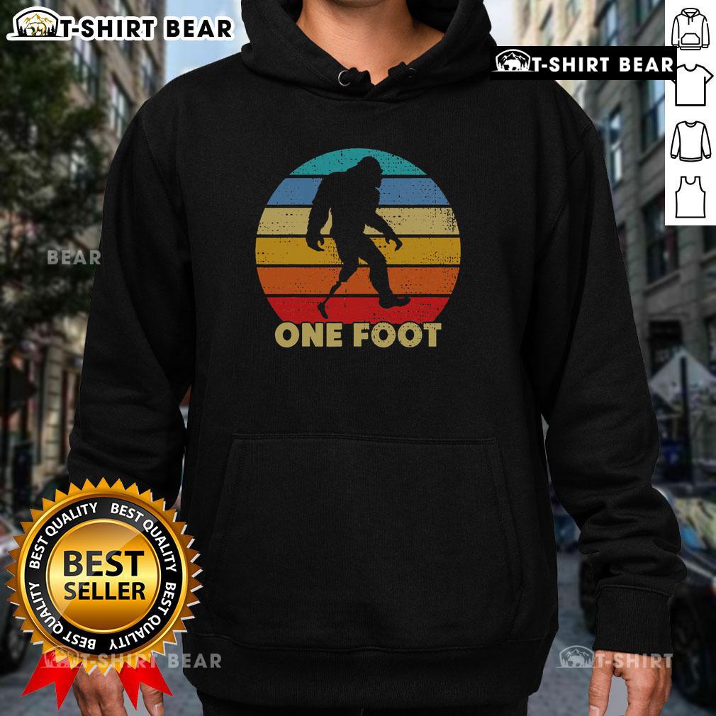 Vintage sunset hoodie featuring a unique Bigfoot prosthetic design for amputated disability awareness.