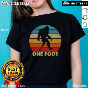 Vintage sunset ladies tee featuring Top One Foot Bigfoot prosthetics for amputated disability awareness.