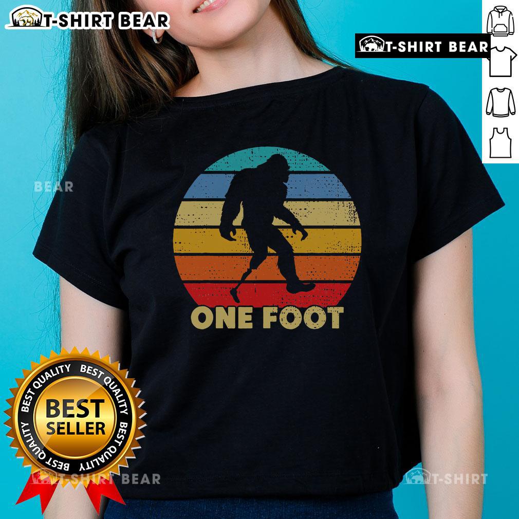 Vintage sunset ladies tee featuring Top One Foot Bigfoot prosthetics for amputated disability awareness.