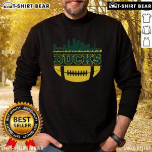 Top Oregon Ducks Apparel featuring a city skyline design on a cozy football sweatshirt, perfect for fans.