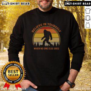Vintage sunset sweatshirt featuring a Sasquatch design with 'Believe in Yourself' slogan, perfect for Bigfoot enthusiasts.