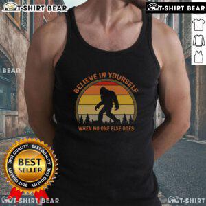 Vintage sunset tank top featuring a Sasquatch design with Believe in Yourself text for Big Foot enthusiasts.