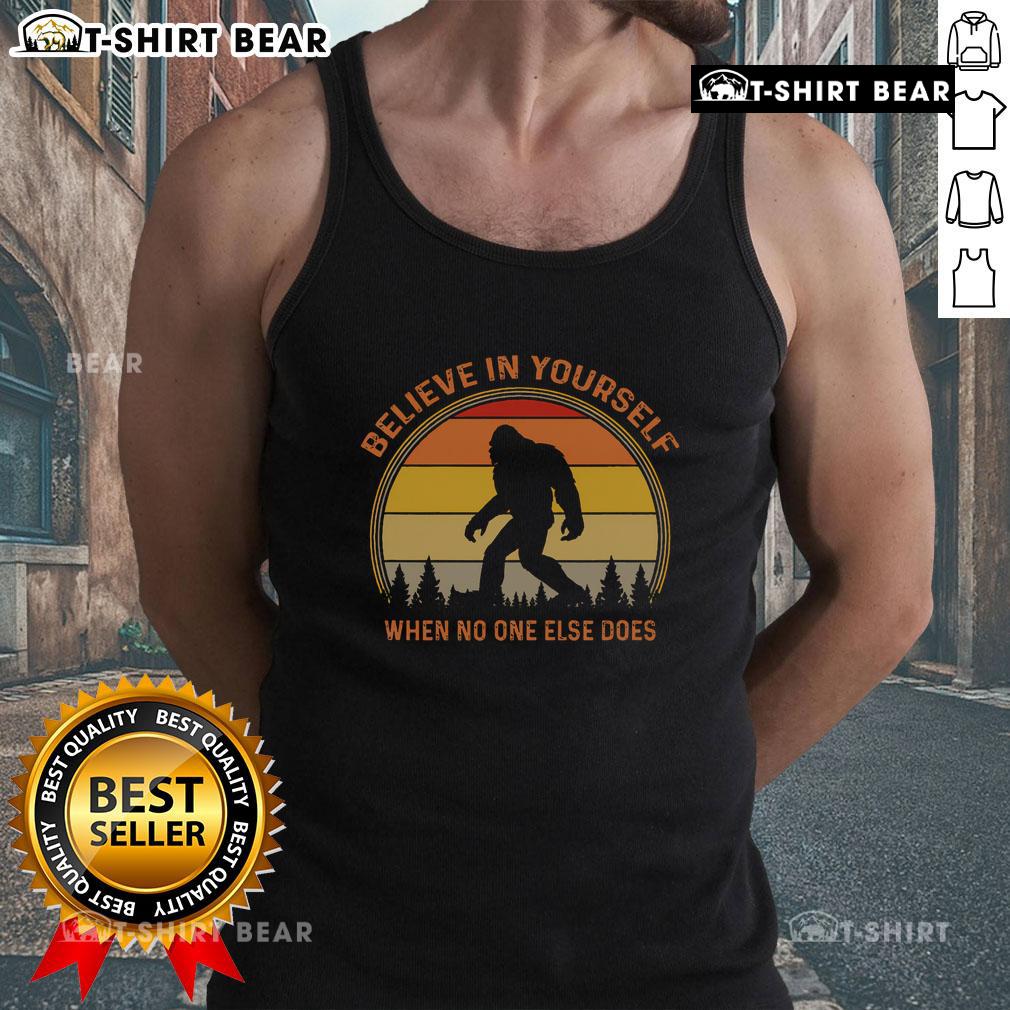 Vintage sunset tank top featuring a Sasquatch design with Believe in Yourself text for Big Foot enthusiasts.