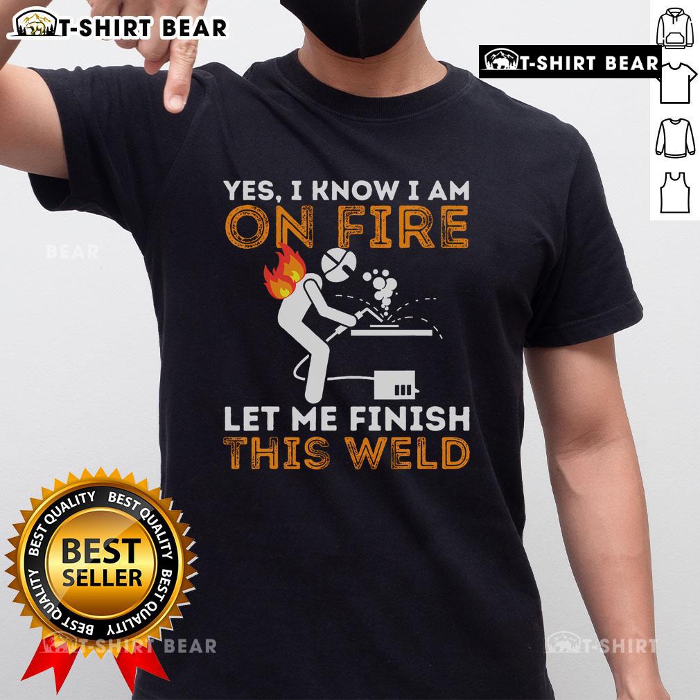 Metal worker wearing 'Yes I Know I Am On Fire' welding t-shirt, showcasing humor and passion for welding skills.