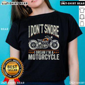 Funny vintage biker tee for ladies with 'I don't snore, I dream I'm a motorcycle' slogan, perfect for motorcycle enthusiasts.