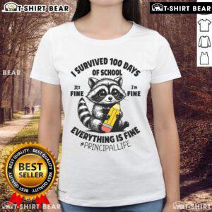 Cute raccoon wearing a '100 Days of School' shirt, conveying a fun message: 'It's fine, everything is fine.'