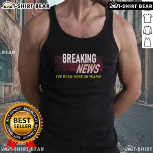 Employee wearing a tank top celebrating 20-year work anniversary with '20th Employee Appreciation' design.