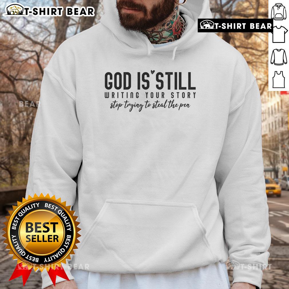 Original God Is Still Writing Your Story hoodie showcasing inspirational design and message about faith and trust.