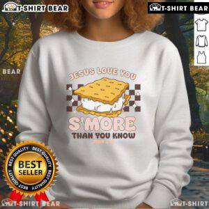 Cozy 'Jesus Loves You' sweatshirt featuring s'mores design, perfect for camping enthusiasts and Christian apparel lovers.