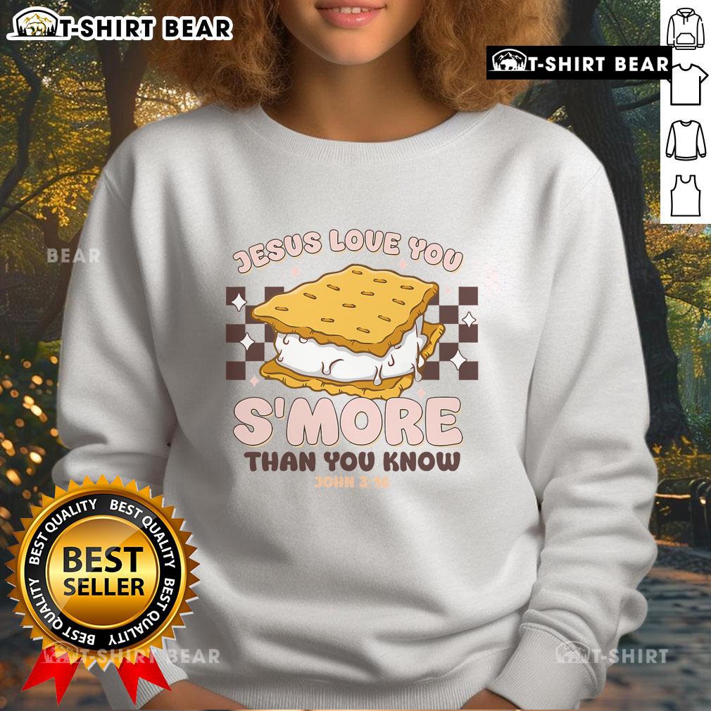 Cozy 'Jesus Loves You' sweatshirt featuring s'mores design, perfect for camping enthusiasts and Christian apparel lovers.