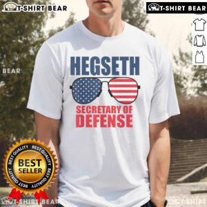 Alt Text: Top Hegseth Secretary of Defense sunglasses on a MAGA support T-shirt featuring Trumps pick for the role.