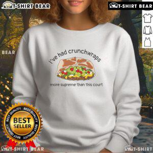 Cozy court sweatshirt featuring a fun 'Crunchwraps More Supreme' design, perfect for Taco Bell fans and casual wear.