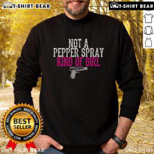 Girl wearing a 'Top Not A Pepper Spray' pro-gun sweatshirt, promoting Second Amendment rights in a stylish design.