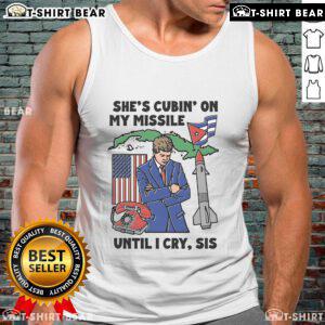 Model wearing a stylish 'Top Shes Cubin On My Missile Until I Cry Sis' tank top, showcasing trendy fashion and vibrant colors.