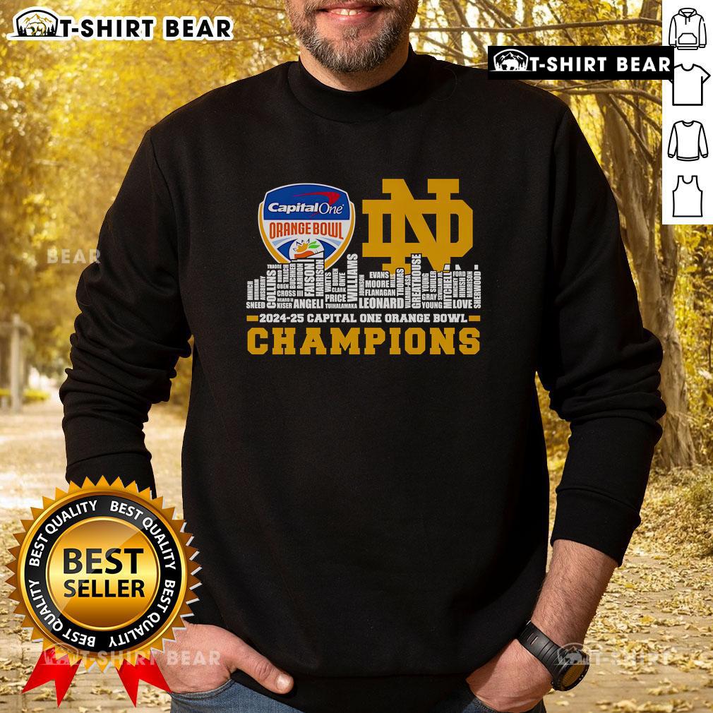 Notre Dame Fighting Irish sweatshirt celebrating Capital One Orange Bowl Champions 2024-25 against a city skyline backdrop.