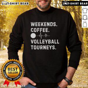 Cozy Top Weekend Coffee and Volleyball sweatshirt displayed on a wooden table with a coffee cup and volleyball in the background.