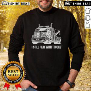Funny I Still Play With Trucks Tow Trucks Sweatshirt design featuring a playful graphic and bold text on a cozy fabric.