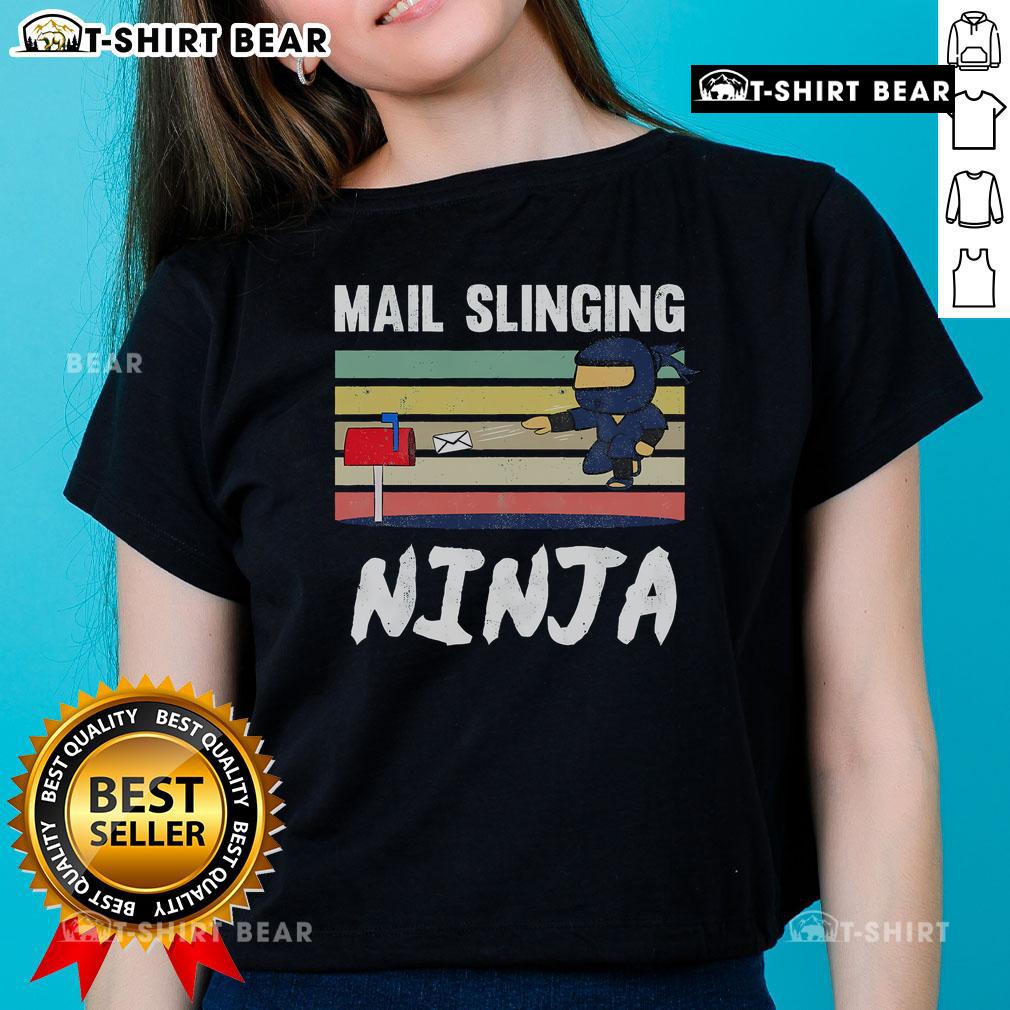 Funny mail-slinging ninja mailman graphic on a retro ladies tee, perfect for postman fans and quirky apparel lovers.