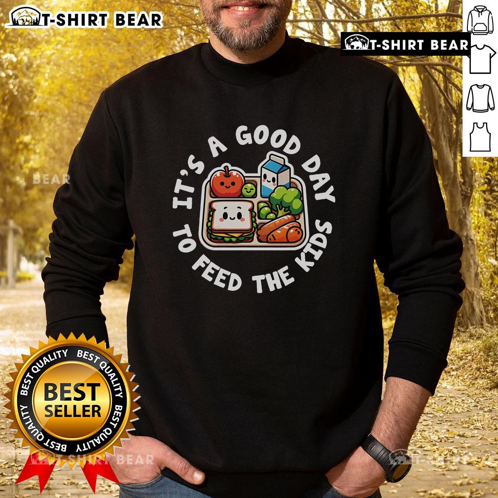 School cafeteria staff worker in 'Good Day to Feed the Kids' sweatshirt, showcasing lunch lady appreciation.