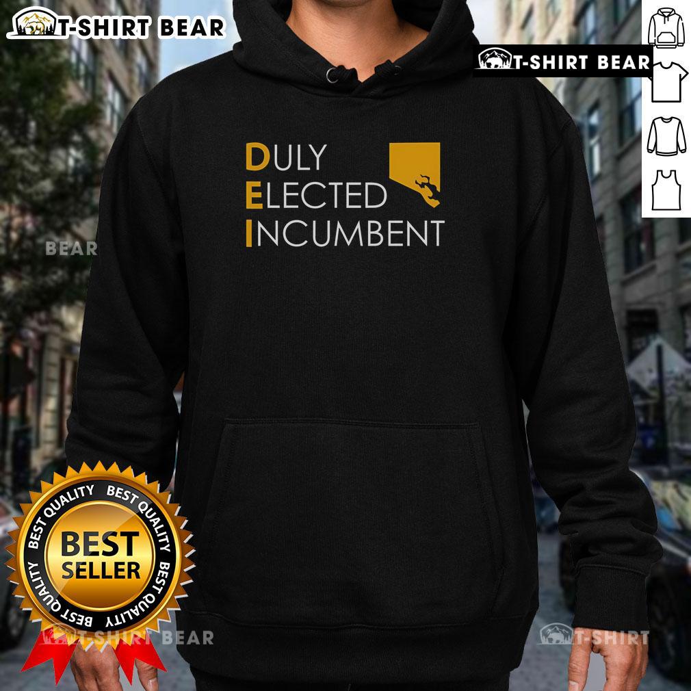 M. Scott wearing a Dei hoodie, proudly representing his status as the duly elected incumbent.