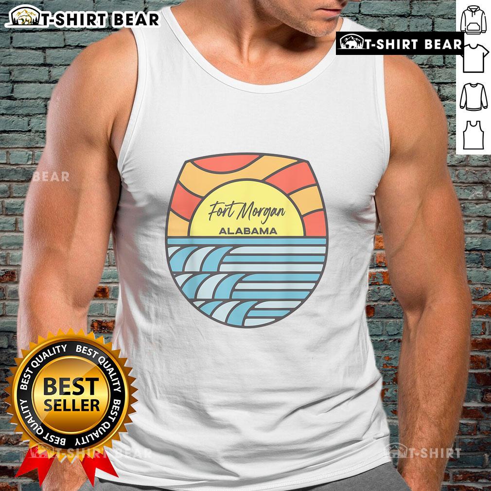 Sunset view over the Gulf of Mexico with a souvenir tank top showcasing Fort Morgan, Alabama's scenic beauty.