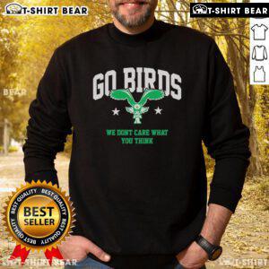 Casual sweatshirt featuring 'We Don't Care What You Think' slogan, perfect for bird lovers. Top Go Birds style.